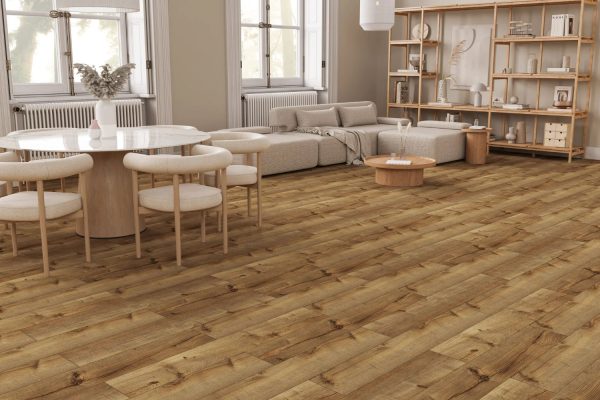A bright living room with wooden floors and white furniture, exemplifying modern design and comfort.